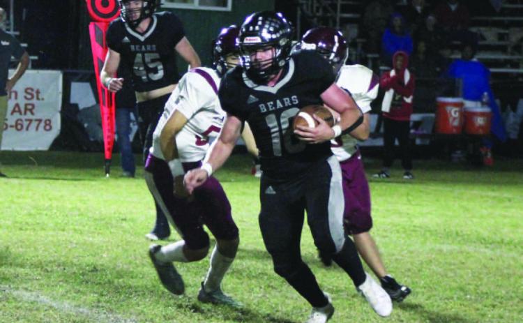 BIG GAME FOR OLIVER - Woodlawn fullback Ethan Oliver (no. 16) b reaks through for a 13-yard pick up in first quarter action against the Augusta Red Devils in the Bears' 40-0 win Friday night. Oliver had his most productive game of the season with 43 yards rushing on six carries with a touchdown.