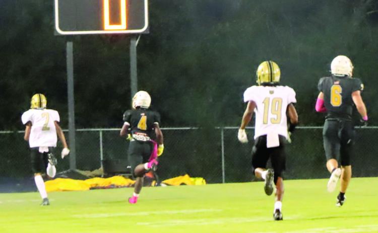 BENNETT EMERGING AS RECEIVER FOR WILDCATS - Rison sophomore rec eiver Braylin Bennett (left, no. 2) races into the end zone ahead of a Harmony Grove defender for a 63-yard touchdown reception to bring the Wildcats even, 6-6, with the Hornets early in the first quarter. Rison Coach Caleb Carmikle praised Bennett's effort, and said his emergence will help provides some balance by giving he 'Cats two solid receivers in Bennett and Za'Kyler Walker. (Photo by Chris Phillips)