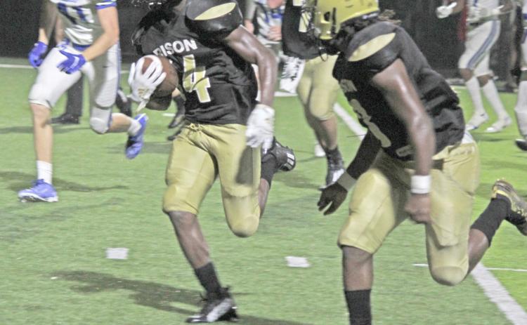 GO-AHEAD SCORE - Rison’s DJ Kines (left, no. 14) breaks loose for a 15-yard touchdown run with 1:36 left in the game to give the Wildcats their first lead, 19-14. Monticello, after seeing its 14-0 halftime lead disappear, mounted a late rally to score with 26 seconds left to pull out a 20-19 victory. Also pictured for Rison is slot player ZaKyler Walker (right, no. 3).