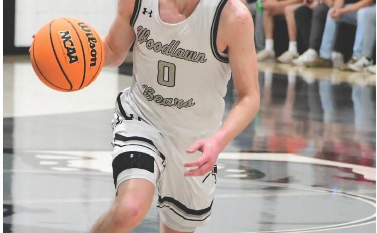 ROBERTS ON FIRE IN SECOND HALF - Woodlawn sophomore guard Jude Roberts had a hot second half against Fordyce In last Wednesday’s 8-2A District Tournament semifinal game scoring 19 of his game-high 23 points over the final two quarters. (Photo by Seymour Weathers)