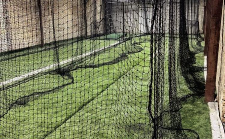 THE DEN - This shots shows the first two batting cages installed in the first building. Austin Saeler said he would like to have two more cages installed in the other building by Halloween. (Photo courtesy of The Den)