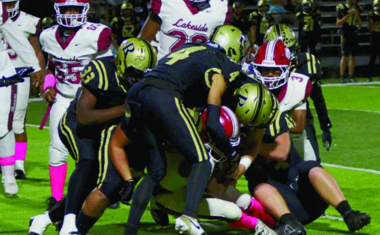 STOPPING CONIC - While Lake Village quarterback Roderick Conic, Jr. scorched Rison for 145 yards rushing and three touchdowns in the first half, the Wildcat defense did a better job of containing him over the final two quarters as he netted just 30 yards. Here, (left to right) Ladarre Eppenger, Dedrick Wells, Braylin Bennett, Tanner Collins and Bryce Phillips corral the elusive Conic on a fourth-down stop in the third quarter.