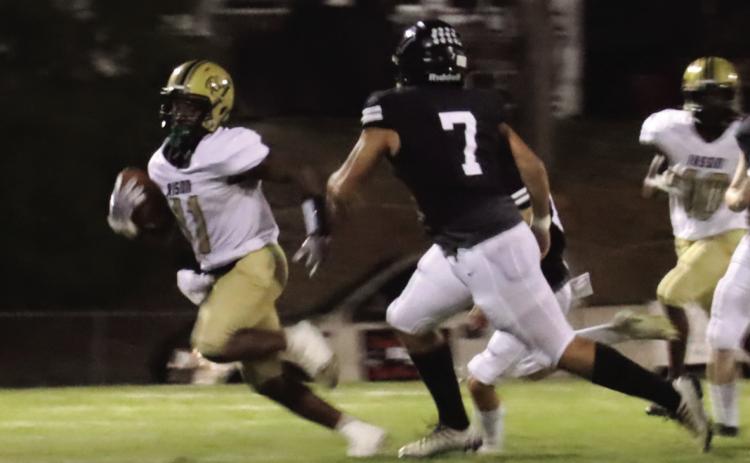 WALKER GETS RISON ON THE BOARD - Rison's Za'Kyler Walker (left, no. 11) eludes the tackle of Bigelow's Keithlin Brown (no. 7) on his way to a 67-yard punt return for a touchdown in the second to give the Wildcats' their first score of the game. Walker had 208 all-purpose yards for the night. (Photo by Chris Phillips)