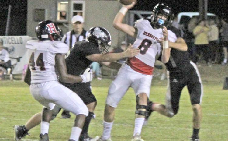 BRINGING HEAT TO THE HERMITS - Woodlawn sophomore Ethan Oliver (left) and senior Jais King (right) bring pressure to Hermitage quarterback J.T. Best (center, no. 8) during the Bears’ 57-0 shutout of the Hermits last Friday night. While Oliver has been a regular contributor on defense, Woodlawn Coach Zach Meyer pointed out that Oliver also earned his first start at offensive guard after a good week of practice.