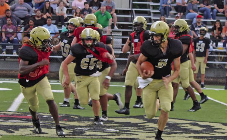 MORRISON EXECUTES RPO - Rison senior-to-be quarterback Owen Morrison breaks outside for a decent gain during the Black and Gold scrimmage last week. Morrison seemed to have picked up the run-pass option rather well as he was picking up some nice gains on the keepers.