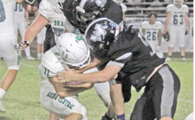 STEVEN ADAIR HAS BIG GAME - Woodlawn linebacker Steven Adair (right, no. 56) closes in with fellow senior Daxton White (middle) to bring down Genoa Central's Caleb McClure. Bears defensive coordinator Alan Neill named Adair his "Defensive Player of the Week" have recording 12 tackles against the Dragons, three for losses.
