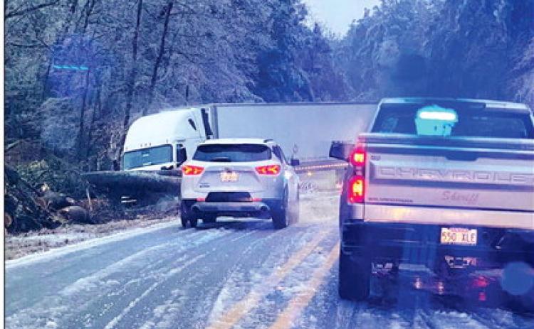 This 18-wheeler ran off Hwy. 35 just south of Rison early Friday morning to avoid colliding with a larger tree that had fallen across the highwy just south of Rison at about 5:30 a.m. Chief Deputy Gary Young said the sheriff's department had four reports of trees falling across roads in the county. In addition to this one, Young said two trees fell across Hwy. 133 north of Rison and another fell across Rodgers Road in the northern part of the county. (Photo compliments of Charlene Freeman).