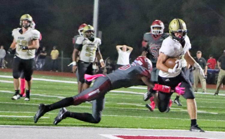 INVOKING THE MERCY CLOCK - Rison’s Eli Turner eludes the tackle of a Lake Village defender to cross into the end zone to push the Wildcats’ lead to 35-0 with 8:53 left in the game to invoke the running clock for the rest of the contest. (Photo by Chris Phillips)