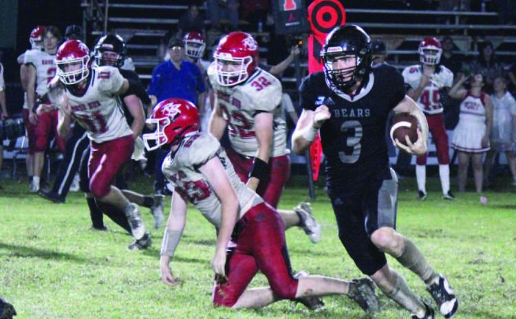MAN ON A MISSION - Woodlawn senior running back Garrett Weather ford (no. 3) breaks free for another nice gain during second half action of the Bears' 50-18 win over Rose Bud. Weatherford averaged 14 yards per carried as he finished with 228 yards rushing and scored seven touchdowns. He scored on touchdown runs of 28, 37 and 35 yards in the third quarter.